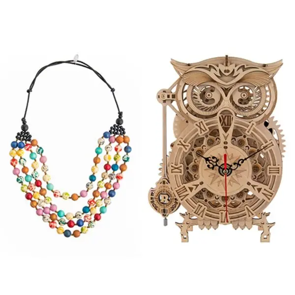 A colorful handcrafted multi-strand wood bead necklace next to an assembled 3D wood owl clock.
