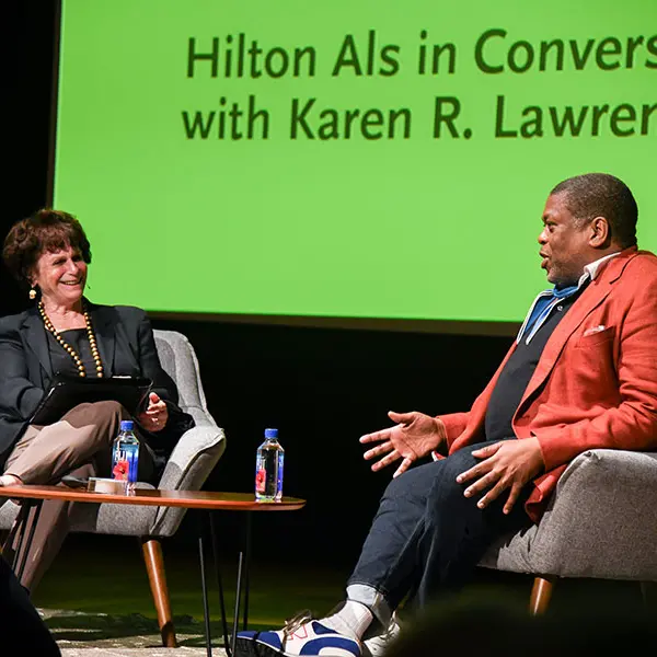 Two people in conversation on a stage.