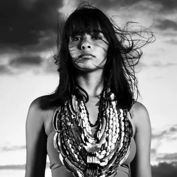 b/w photo of woman with beaded necklaces