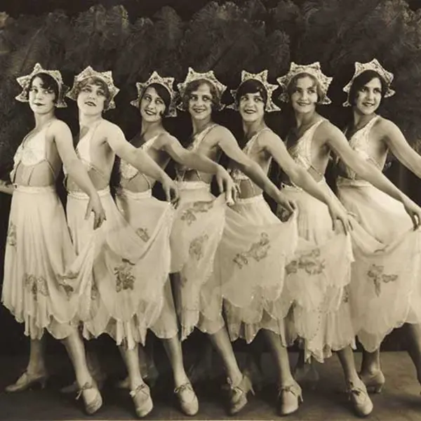 Group of dancers in the 20s in a row