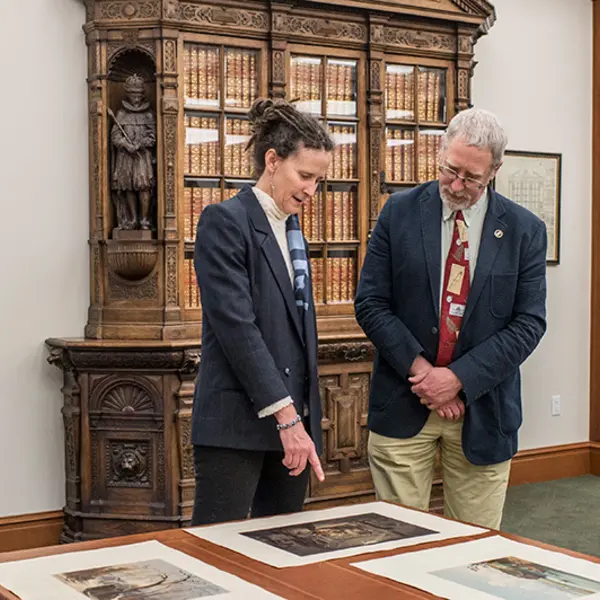 Pulitzer Prize–winning historians Elizabeth Fenn and Alan Taylor looking at items from The Huntington’s collections