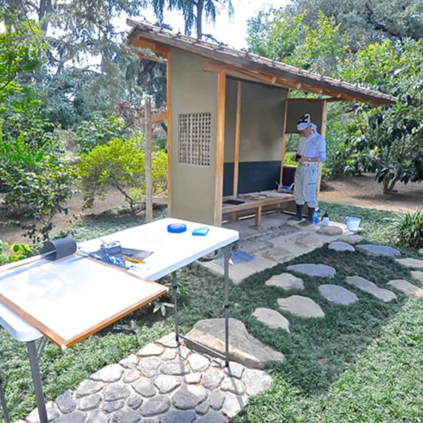 Restoration of rice paper walls on waiting bench in the Japanese Garden