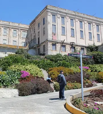 The Alcatraz Island Prison exterior, with a lush succulent and cactus garden below.