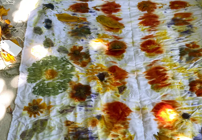 A fabric with colorful shapes made using natural dyes.