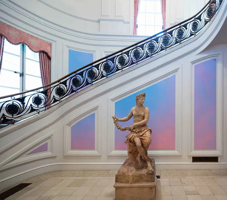 Installation of Alex Israel's Sky Backdrop Mural, 2015, in the main hallway of the Huntington Art Gallery. Photo by Fredrik Nilsen, courtesy of The Huntington.
