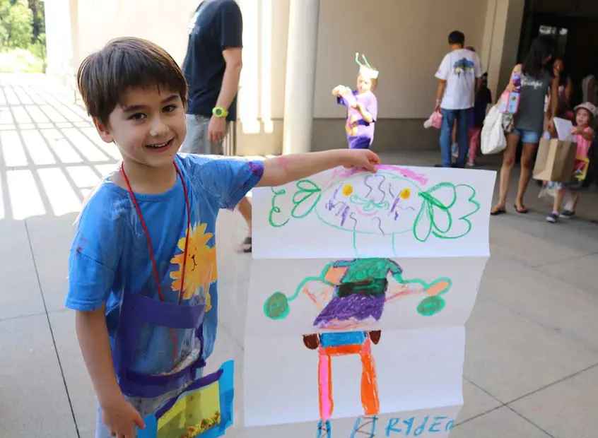 Boy showing his drawing project