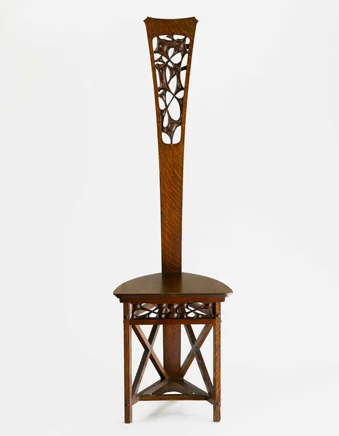 Charles Rohlfs (American, 1853-1936) and Anna Katharine Green (American, 1846–1935), Desk Chair, ca. 1898–1899. From the Rohlfs home. Oak, 53 15/16 x 15 15/16 x 16 7/8 inches. Metropolitan Museum of Art, Promised Gift of American Decorative Art 1900 Foundation in honor of Joseph Cunningham. Photo by Gavin Ashworth © American Decorative Art 1900 Foundation.