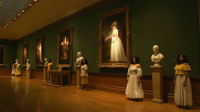 Video still depicting dancers in the Thornton Portrait Gallery in the Huntington Art Gallery, from Apariciones/Apparitions, a video work by Carolina Caycedo. Choreography by Marina Magalhães; cinematography by David de Rozas. Jointly owned by The Huntington Library, Art Collections, and Botanical Gardens and the Vincent Price Art Museum Foundation. Image courtesy of the artist.