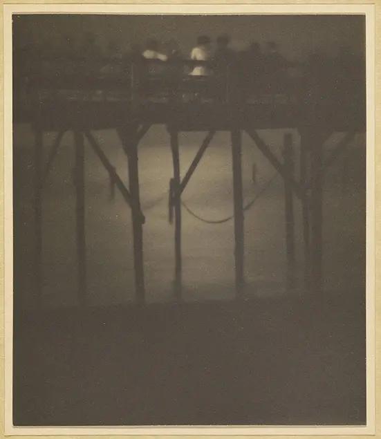 12.	Karl F. Struss, Crowded Pier by Moonlight, Arverne, Long Island, New York, 1910–1912, sepia toned platinum print, 4 1/4 × 3 5/8 in. The J. Paul Getty Museum, Los Angeles. © 1983 Amon Carter Museum of Art, Fort Worth, Texas.