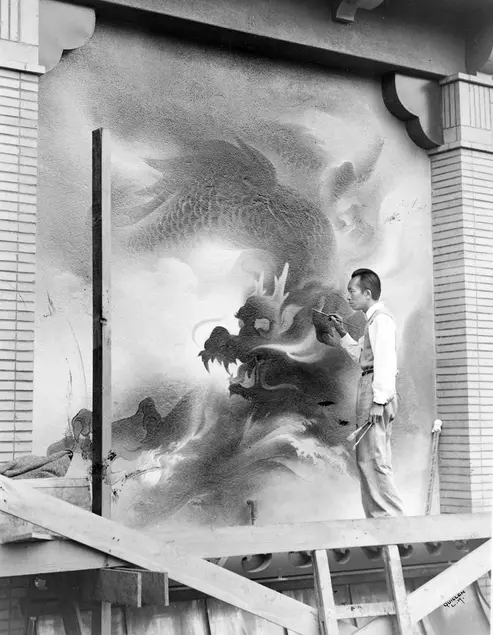 Artist Tyrus Wong paints a dragon mural on building exterior in Chinatown Central Plaza, 1941. Los Angeles Public Library, Harry Quillen Photo Collection.