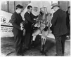 Wiley Post, Bill Parker, and Capt. Balderston (left to right) conferring with an unidentified pilot wearing the sub-stratosphere suit, 1935. Post used the suit to fly to an unofficial record of 55,000 feet. On a later flight, after a forced landing, the alien-looking pressure suit alarmed local residents. Huntington Library, Art Collections, and Botanical Gardens.