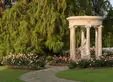 The centerpiece of The Huntington's historic Rose Garden is the 18th-century French stone tempietto encircling a sculpture titled Love, the Captive of Youth. Appropriately, the tempietto is surrounded by a bed of 