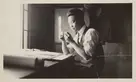 Peter SooHoo Sr. working at a drafting table, 1920s. The Huntington Library, Art Museum, and Botanical Gardens.