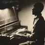 Claudius Wilson on a piano
