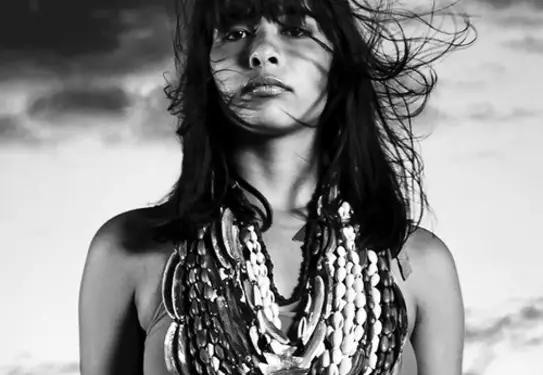 b/w photo of woman with beaded necklaces