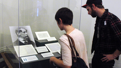 Visitors view Dickens' letters and first editions of literary manuscripts Visitors view Dickens' letters and first editions of literary manuscripts