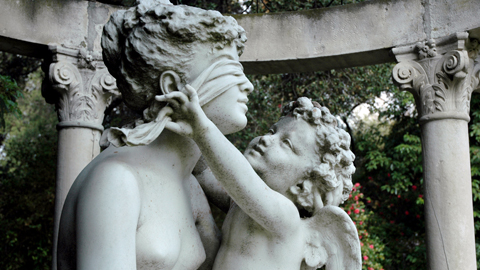 Cupid blindfolds Youth in a 19th-century statue in the North Vista. Cupid blindfolds Youth in a 19th-century statue in the North Vista.