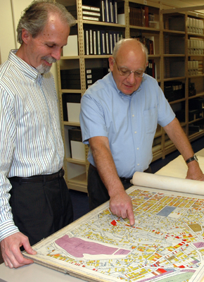 Alan Jutzi (right), chief curator of rare books, and colleague David Mihaly look at one of the L.A. city maps used by researchers developing the video game project. Alan Jutzi (right), chief curator of rare books, and colleague David Mihaly look at one of the L.A. city maps used by researchers developing the video game project.