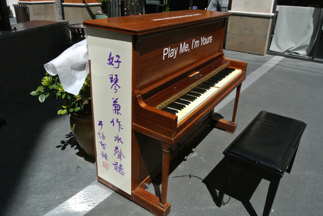 PianoAtlanticNew The calligraphy of Peizhu and Qian Yu adorns the piano at Atlantic Times Square in Monterey Park