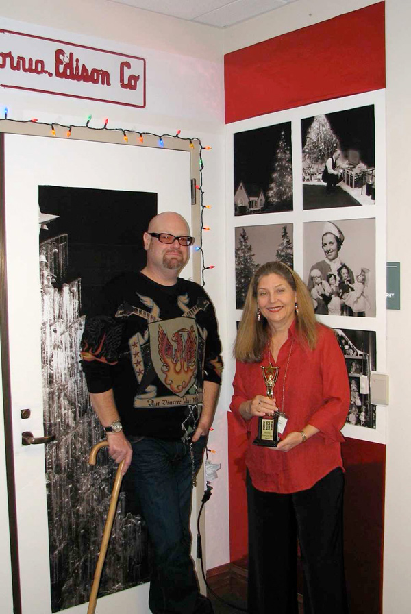 Steve Smith with Devonne Tice, library assistant in The Huntington’s image archives, standing in front of their department’s holiday door decoration in December 2007.
