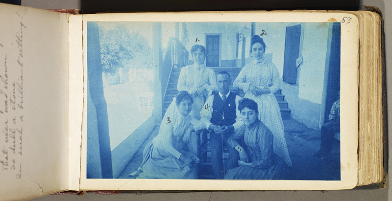 Cyanotype photograph of Charles Lummis (at center, holding the shutter release) with Susanita Del Valle (right front) and her sisters, ca. 1888.