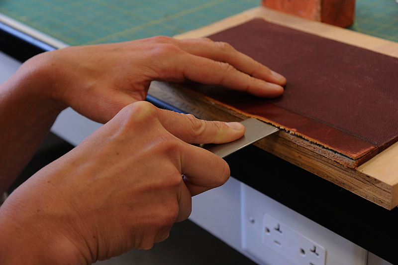 Lifting knives allow conservators to lift leather, cloth, and paper so that new material can be tucked underneath the original.