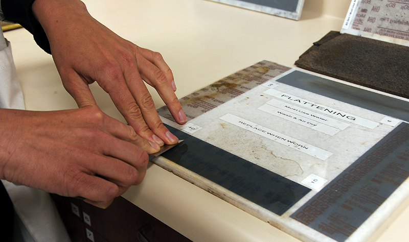 When sharpening a knife, conservators start with coarser grits of abrasive material and then move on to finer grits.