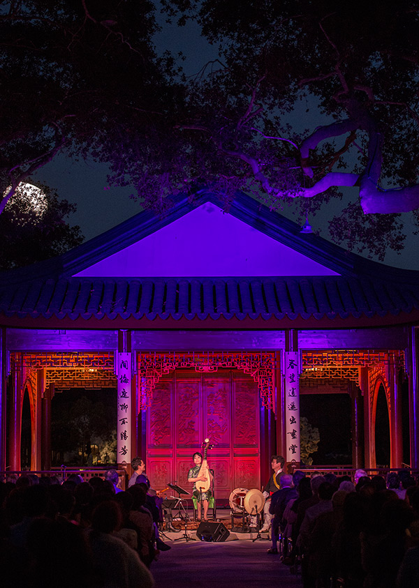 Wu Man (center), playing alongside Kojiro Umezaki (left) and Dong-Won Kim (right), delivered the inaugural performance at the Chinese Garden’s Clear and Transcendent pavilion on June 18, 2014. Photos by Martha Benedict. 