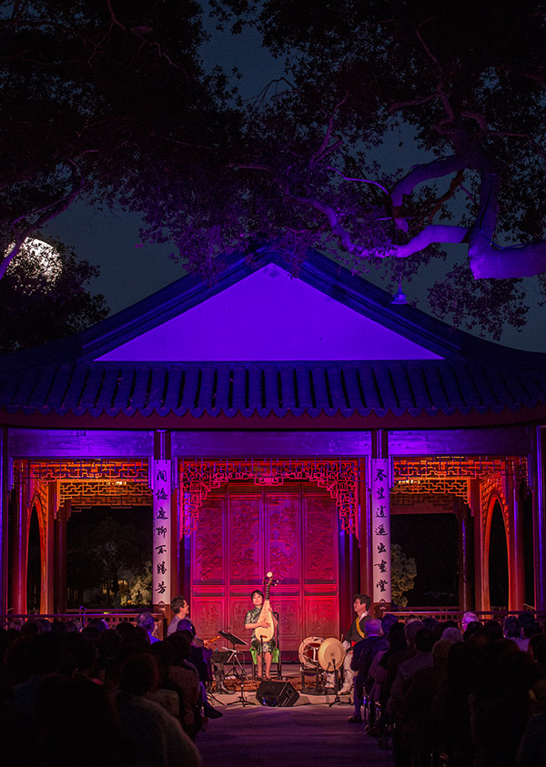 Wu Man (center), playing alongside Kojiro Umezaki (left) and Dong-Won Kim (right), delivered the inaugural performance at the Chinese Garden’s Clear and Transcendent pavilion on June 18, 2014. Photos by Martha Benedict.