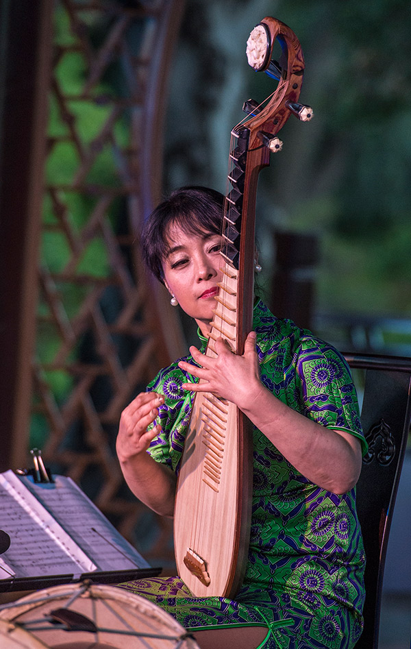 Wu Man playing the pipa, or Chinese lute.