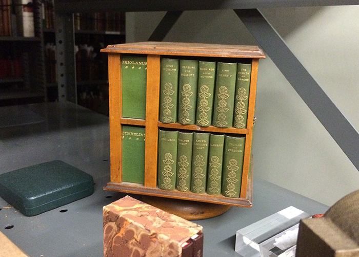 Miniature Shakespeare books in a six-inch-high, rotatable bookcase.