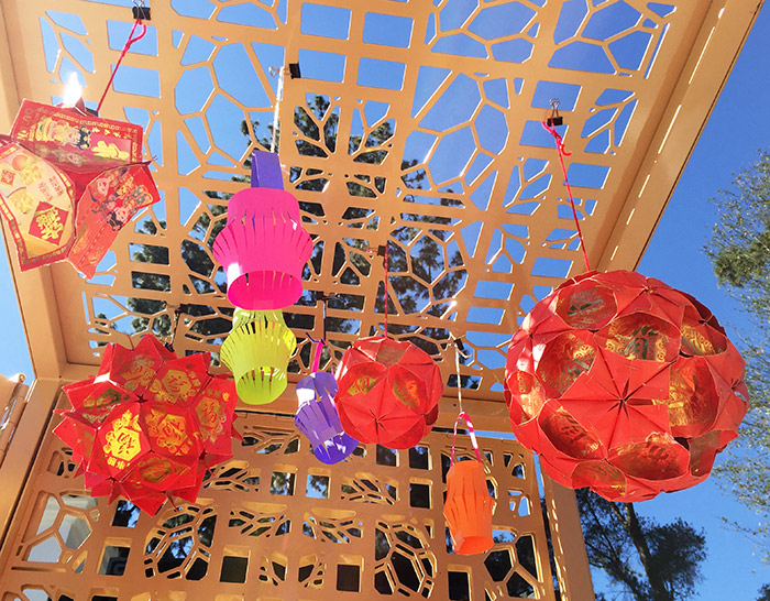 Paper lanterns, some made of red lucky envelopes (laisee or hong bao), enliven the latticework of the new Chinese Garden Discovery Cart.