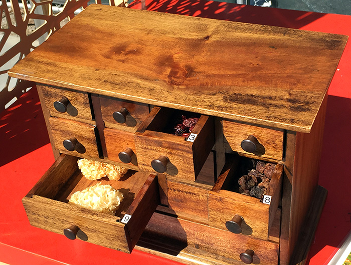 An apothecary box containing: (3) dried Chinese dates, also known as jujube; (8) dried longan; and (9) snow fungus.