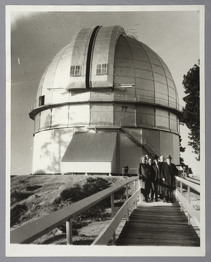 Left to right: Albert Einstein, Edwin Hubble, Walther Mayer, Walter S. Adams, Arthur S. King, and William W. Campbell pose in front of the 100-inch telescope dome at Mount Wilson Observatory. Jan. 29, 1931. The Huntington Library, Art Collections, and Botanical Gardens. 