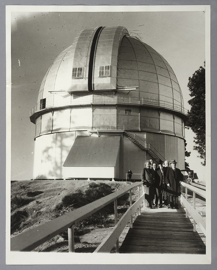 Left to right: Albert Einstein, Edwin Hubble, Walther Mayer, Walter S. Adams, Arthur S. King, and William W. Campbell pose in front of the 100-inch telescope dome at Mount Wilson Observatory. Jan. 29, 1931. The Huntington Library, Art Collections, and Botanical Gardens.