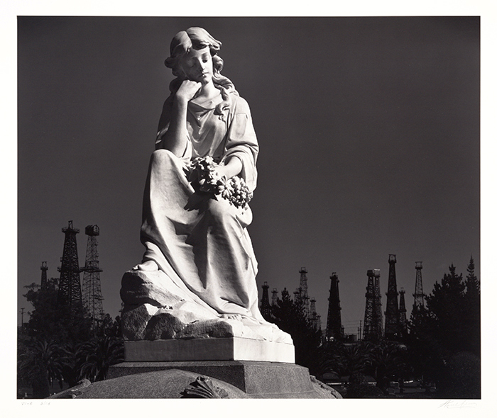 Cemetery Statue and Oil Derricks, Long Beach, 1939. Photograph by Ansel Adams (1902–1984). Gelatin silver print, 15 ¼ x 18 3/8 in. © 2015 The Ansel Adams Publishing Rights Trust. Gift of George Melvin Byrne and Barbara S. Barrett-Byrne.