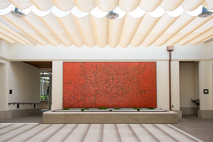 Doyle Lane, Mutual Savings and Loan Mural, 1964, clay, 17 × 8 ft., as installed in the courtyard of the June and Merle Banta Education Center, part of the Steven S. Koblik Education and Visitor Center. The Huntington Library, Art Collections, and Botanical Gardens.