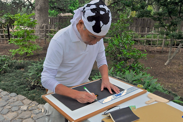 The landscape designer takes careful measurements and then cuts new pieces. Photo by Andrew Mitchell.