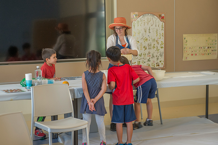 Children were surprised to discover how many oranges it took to make enough juice for all of them to have a taste. Photo by Martha Benedict.