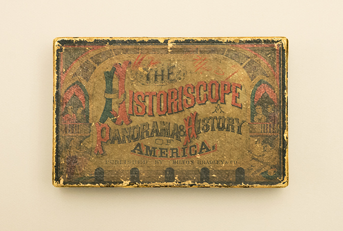 The well-worn cover of The Historiscope: A Panorama and History of America, published by Milton Bradley Co., ca. 1870, toy panorama with hand-colored lithographs, 8 1/4 x 5 1/4 x 2 1/2 in. The Huntington Library, Art Collections, and Botanical Gardens.