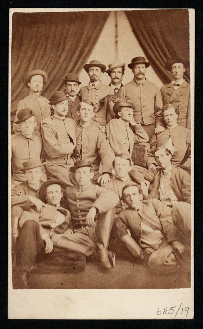 Col. John S. Mosby and Some of His Men, ca. 1863, printed later. Albumen carte-de-visite print. Confederate commander Mosby, seated and wearing a feathered cap, earned the nickname “Gray Ghost” for his lighting attacks and ability to elude capture. Photograph by Lee Gallery (active 1870s). The Huntington Library, Art Collections, and Botanical Gardens.