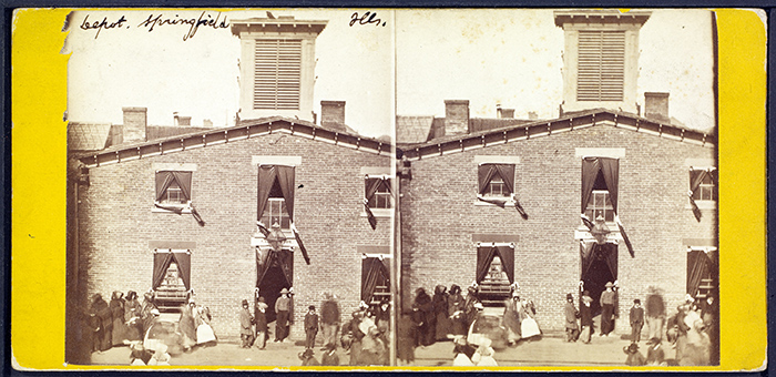 Great Western Depot, Springfield, Illinois. 1865. Albumen stereographic print. Dark bunting shrouds the railroad depot, the final stop of Lincoln’s funeral procession. Attributed to Schreiber & Glover (active ca. 1864–66). The Huntington Library, Art Collections, and Botanical Gardens.