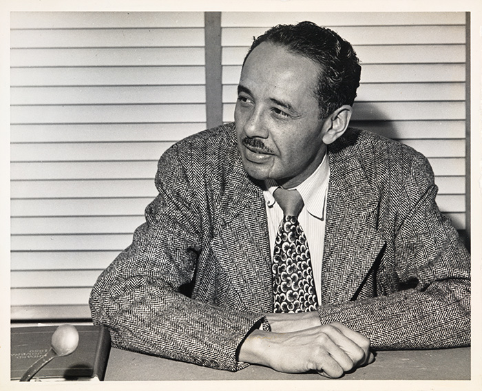 Loren Miller, seated at desk, ca. 1950. Unknown photographer. Loren Miller Collection. The Huntington Library, Art Museum, and Botanical Gardens.