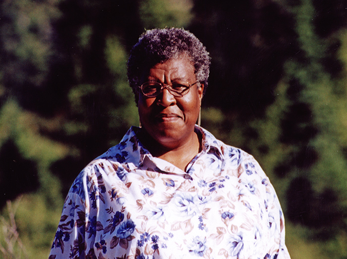 Detail of photograph of Octavia E. Butler, photographer unknown, 2001. Octavia E. Butler papers. The Huntington Library, Art Collections, and Botanical Gardens. Copyright Estate of Octavia E. Butler.