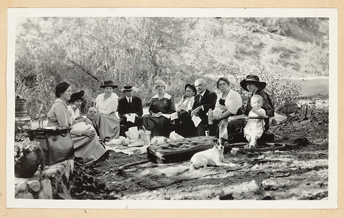 Ralph Arnold shot this 1918 photo of his wife, Winninette Arnold, (sixth from left), in Pasadena, Calif., with friends and family, including Winninette’s mother, Ora Stokes (fourth from left), brother, Frank Stokes Jr. (fifth from left), father, Frank Stokes (fourth from right, with moustache), and sister, also named Ora Stokes (third from right, next to father, Frank Stokes). The Huntington Library, Art Collections, and Botanical Gardens.