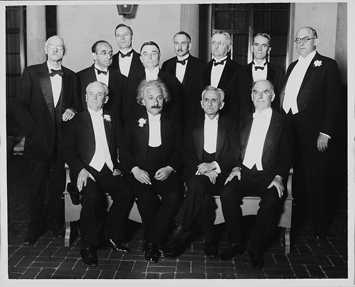 Banquet given by Caltech associates in honor of Albert Einstein on Feb. 15, 1931. Sitting (from left to right): Robert Millikan, Einstein, Albert Michelson (these first three were Nobel laureates), and William Wallace Campbell. Standing (left to right): Charles St. John, Walter Mayer, Edwin Hubble, William Nunro, Richard Tolman, Allan Balch, Walter Adams, and Russell Ballard. The Huntington Library, Art Collections, and Botanical Gardens.