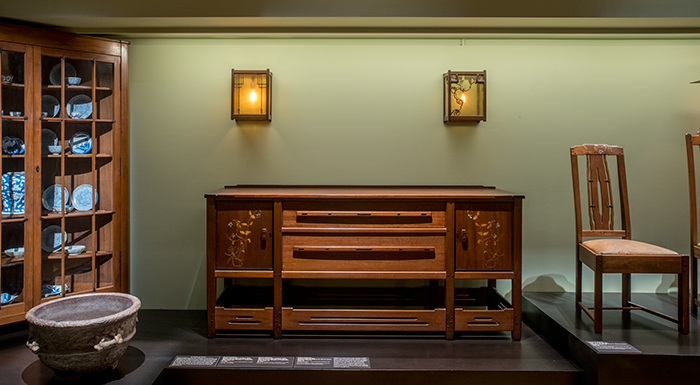  The sideboard and side chair from the 1909 Thorsen house in Berkeley, Calif. with above them two wall lanterns made for the 1902 James A. Culbertson house.
