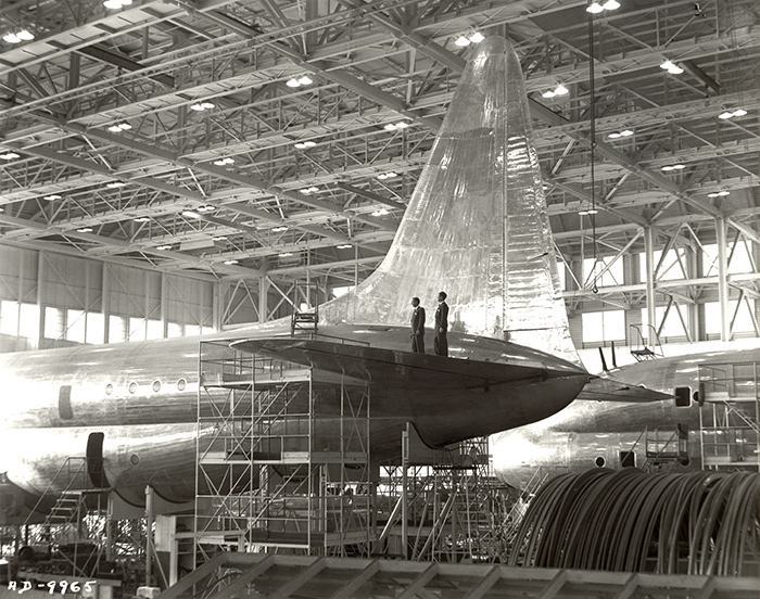 The tail section of the Constitution, an aircraft under construction at Lockheed Aircraft Co., Burbank, 1946. Harvey Christen collection. The Huntington Library, Art Collections, and Botanical Gardens.