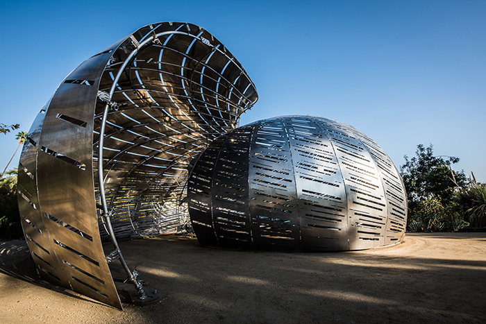 The 72 panels of water-jet cut aluminum are bolted to the frame to create a double-curved shell. Photo by Dan Goods.