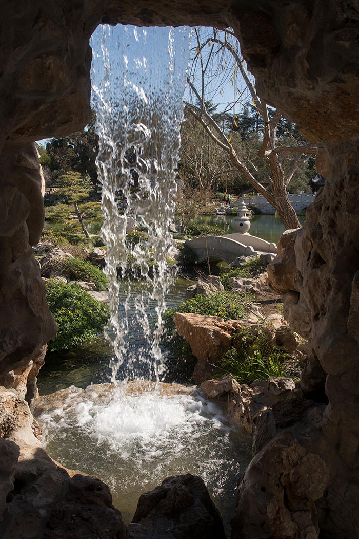 The view from behind a waterfall in the Chinese Garden, also known as Liu Fang Yuan 流芳園, the Garden of Flowing Fragrance